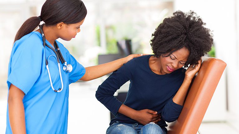 Pain---African-American-female-w-nurse